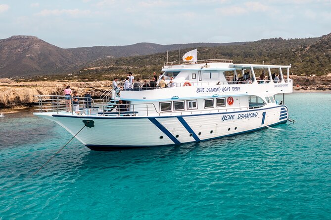 Blue Lagoon cruise: giant slide, music & Paphos hotel transfers - Fruit, drinks, and music onboard