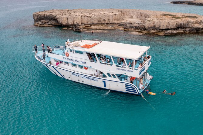 Blue Lagoon trip with slide & music departing from Latchi harbour - Drinks, fruit, music, and the onboard mood