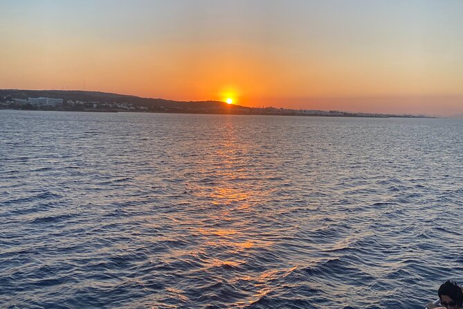 Sunset Boat Trip to Cape Greco and Blue Lagoon - The natural rock bridge and a note about accuracy